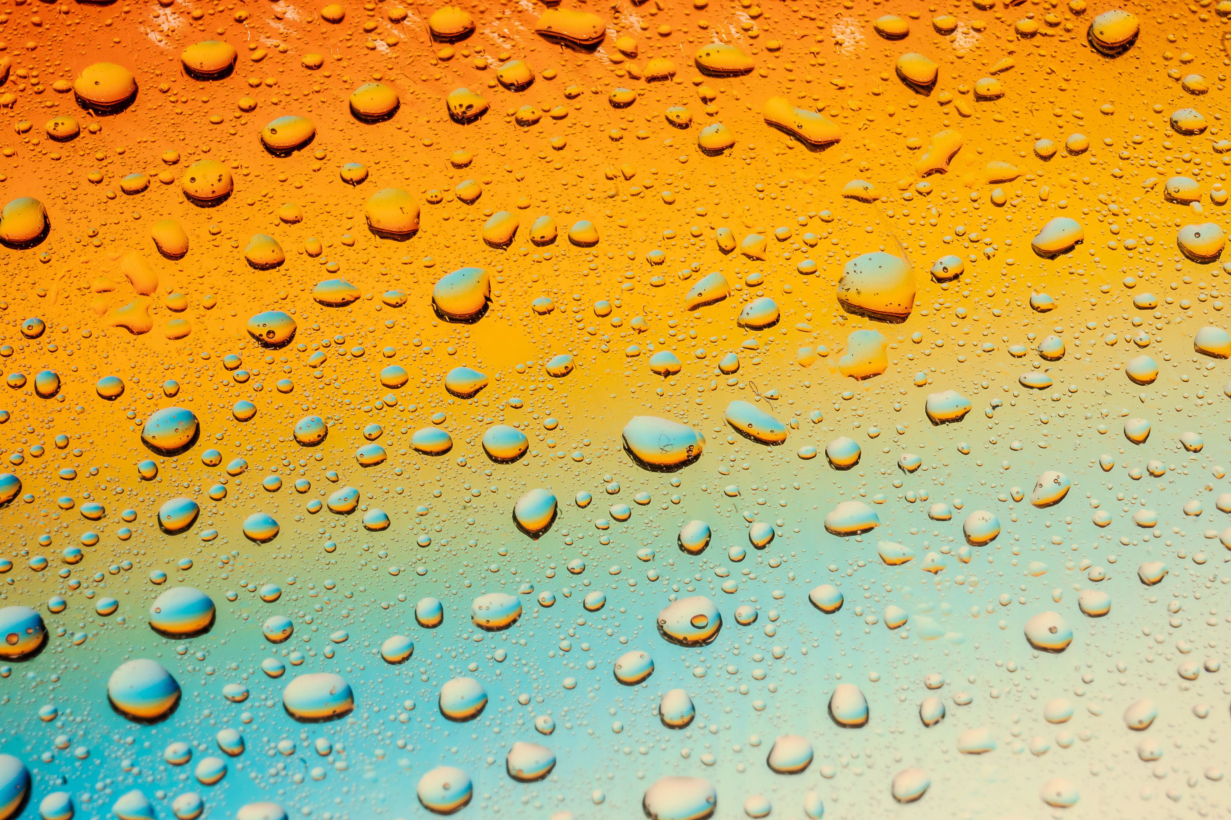 Colorful image of water droplets on a gradient background showcasing vivid hues.