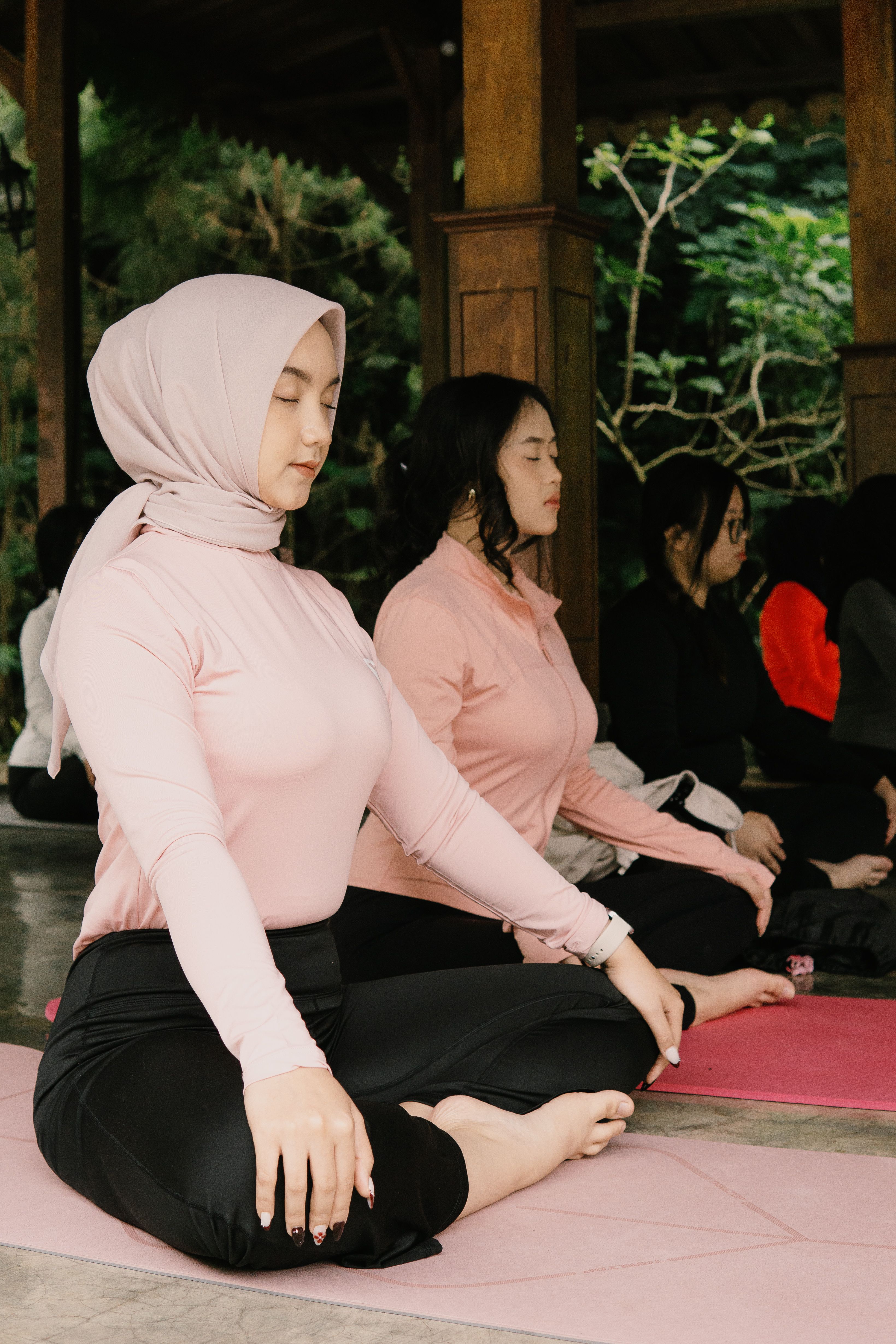 A serene group meditation session at a pavilion in Jawa Barat, Indonesia.