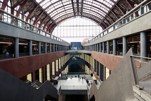Inside view of a modern train station with high ceilings and natural light.