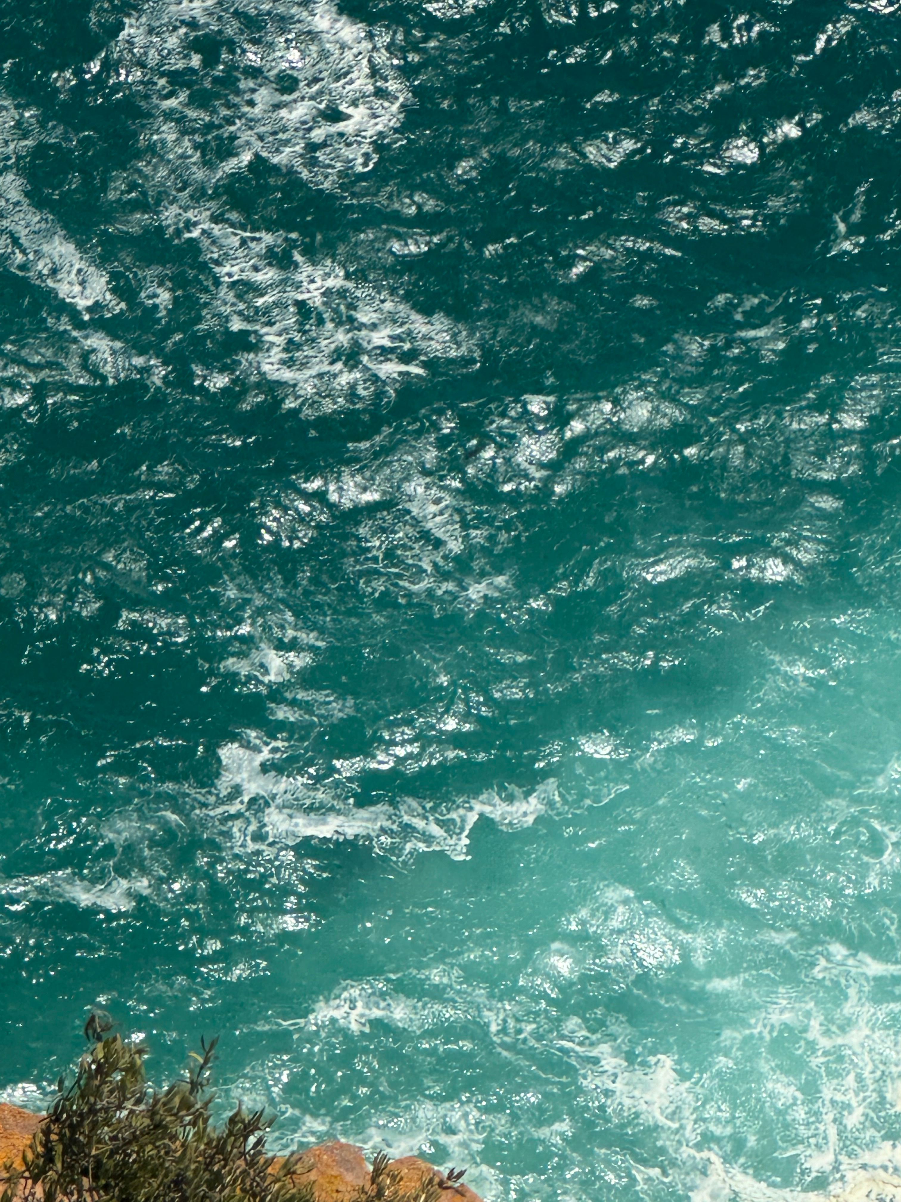 Captivating aerial shot of turquoise ocean waves near Cape Town, South Africa.