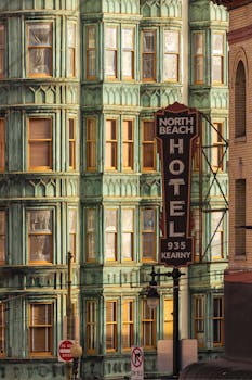 A view of the iconic North Beach Hotel in San Francisco with ornate architecture and vintage sign.