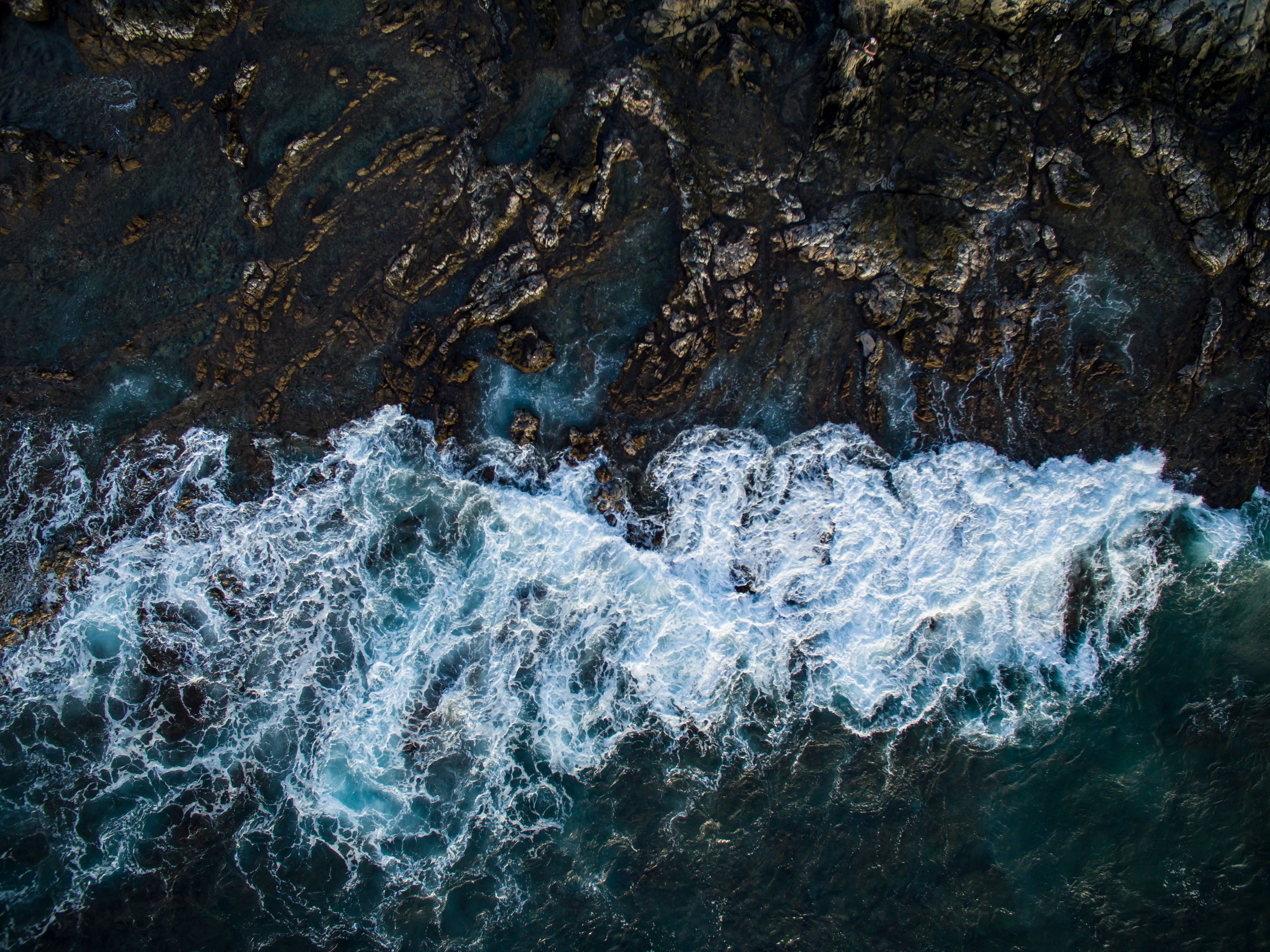 Best Birds Eye View 30 Minute Maui Helicopter Tour Review: The Perfect Introduction to Aerial Paradise Review 2026 - A breathtaking aerial view of ocean waves crashing against the rocky coastline of Maui, Hawaii.