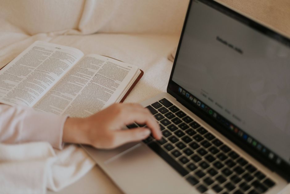person reading laptop content research