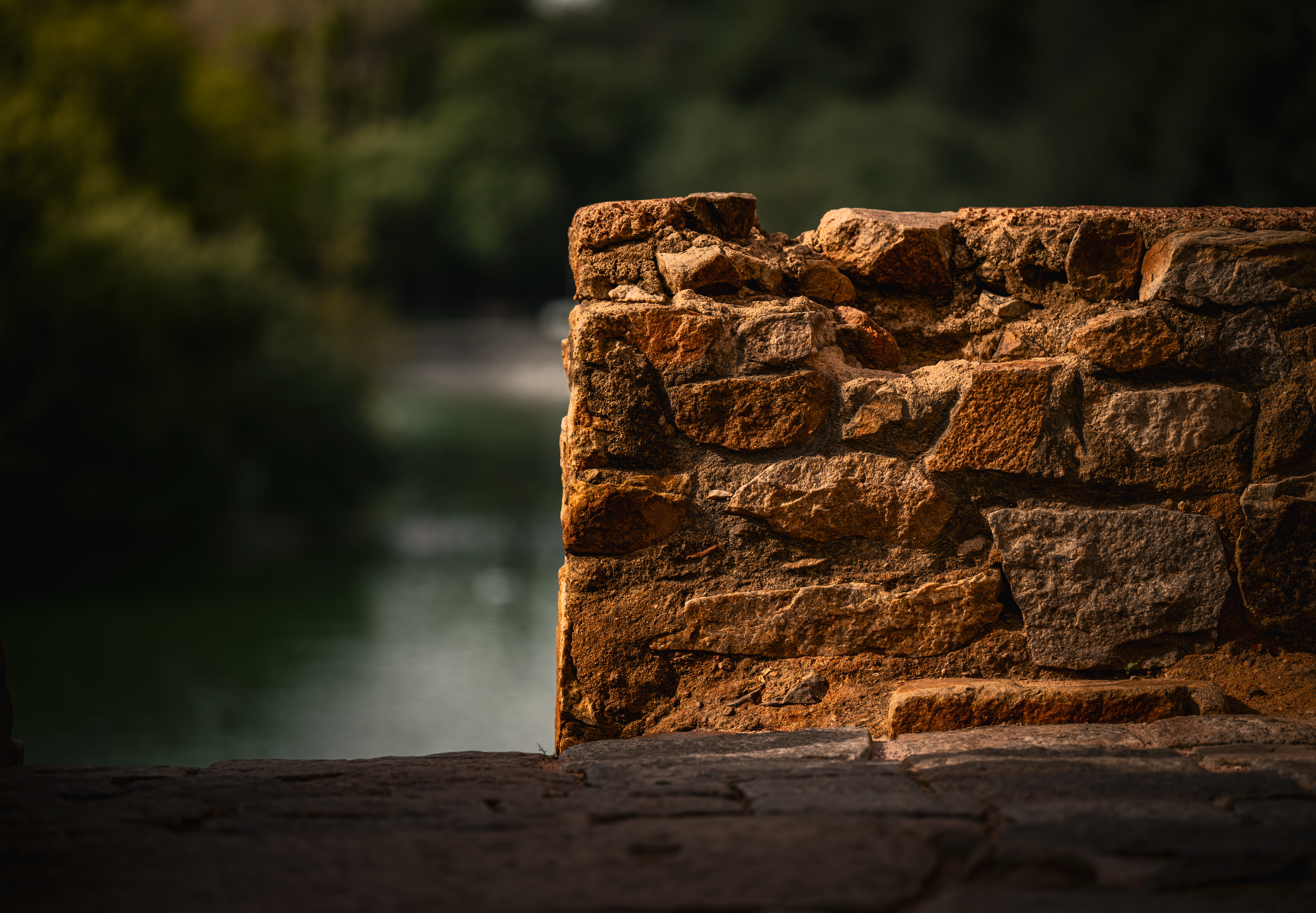 Ancient Stone Wall with Scenic Nature View · Free Stock Photo