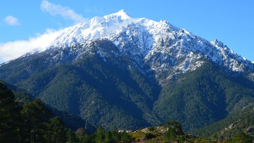 Free Breathtaking view of a snow-covered mountain peak in Vivario, Corse, France. Stock Photo