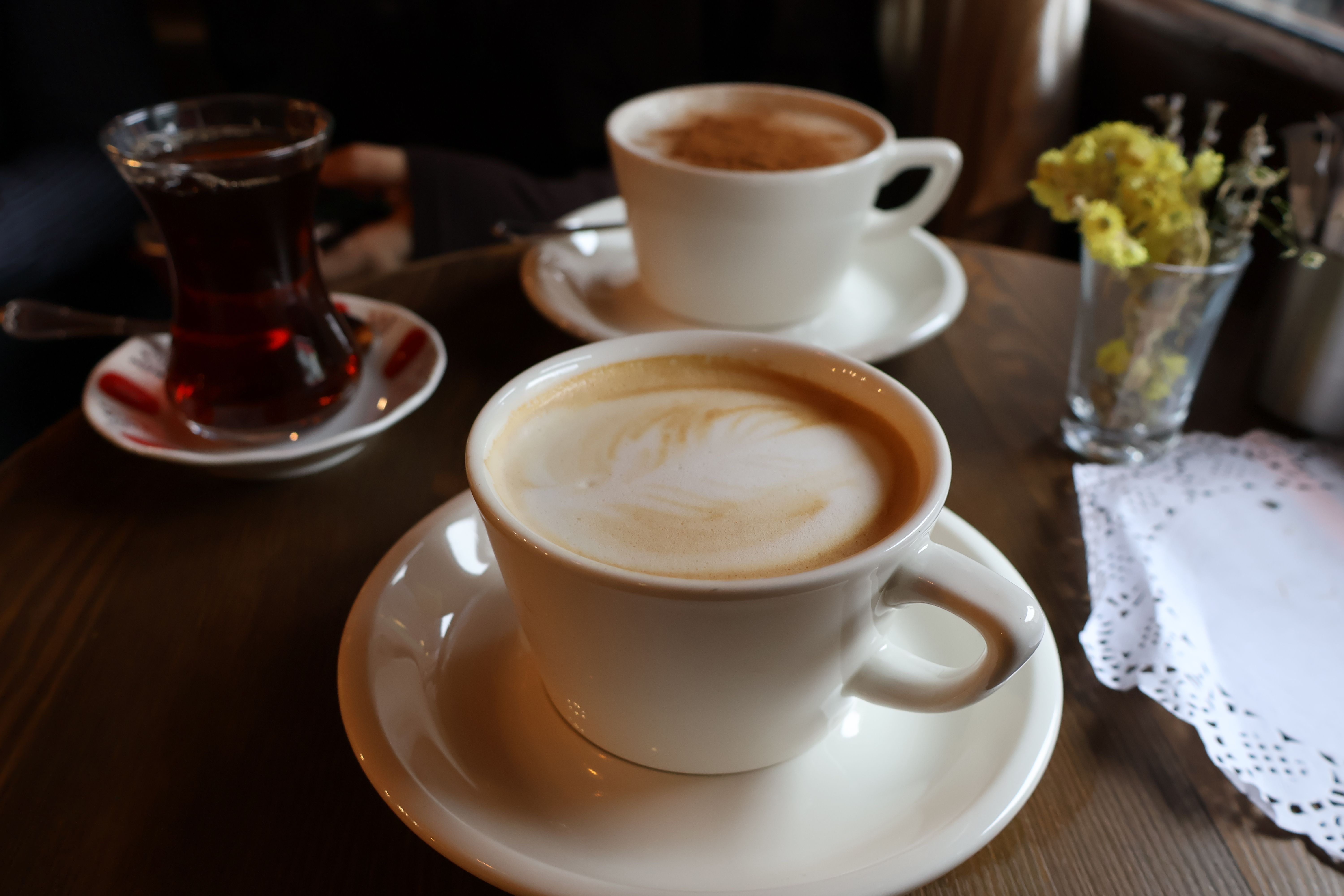 Cozy Cafe Setting with Lattes and Tea · Free Stock Photo