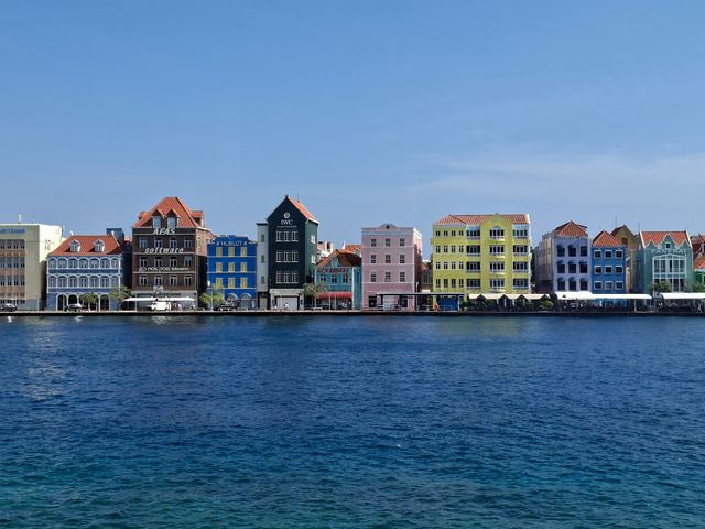 Vibrant Dutch colonial buildings along the waterfront in Willemstad, Curacao.