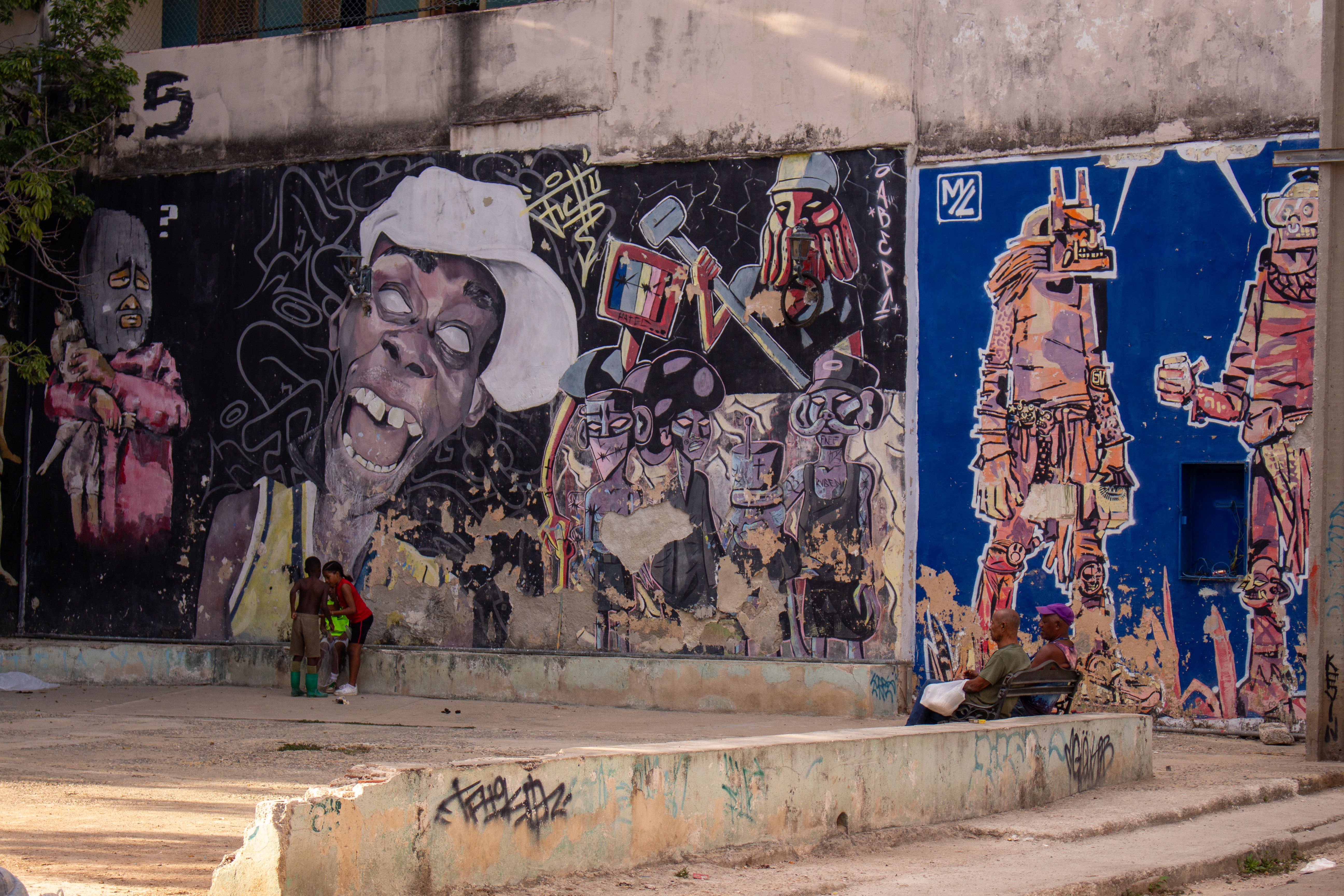 Hand-painted canvases and crafts at Mercado de Artesanía San José in Havana, Cuba