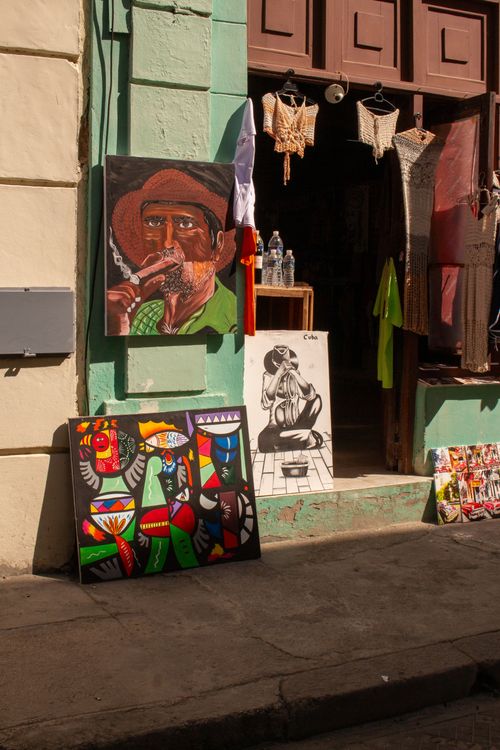 Free Colorful street art and paintings displayed outside a shop in Havana, Cuba. Stock Photo