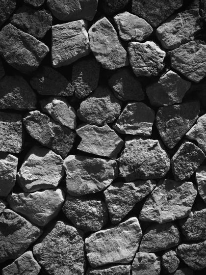 Weathered stone wall texture, photo by Anton Stepanov on Pexels