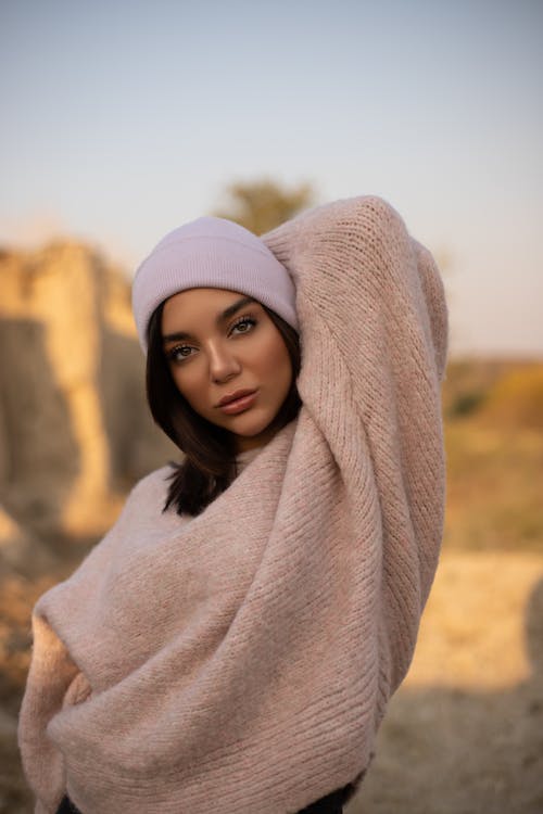 Woman in White Knit Cap and Gray Sweater