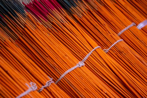 Free Close-up view of colorful bundled incense sticks arranged in neat rows for sale or display. Stock Photo