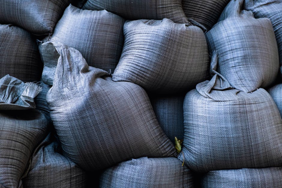 Photo by Javid Hashimov Close-up of stacked sandbags used for flood protection and emergency management.