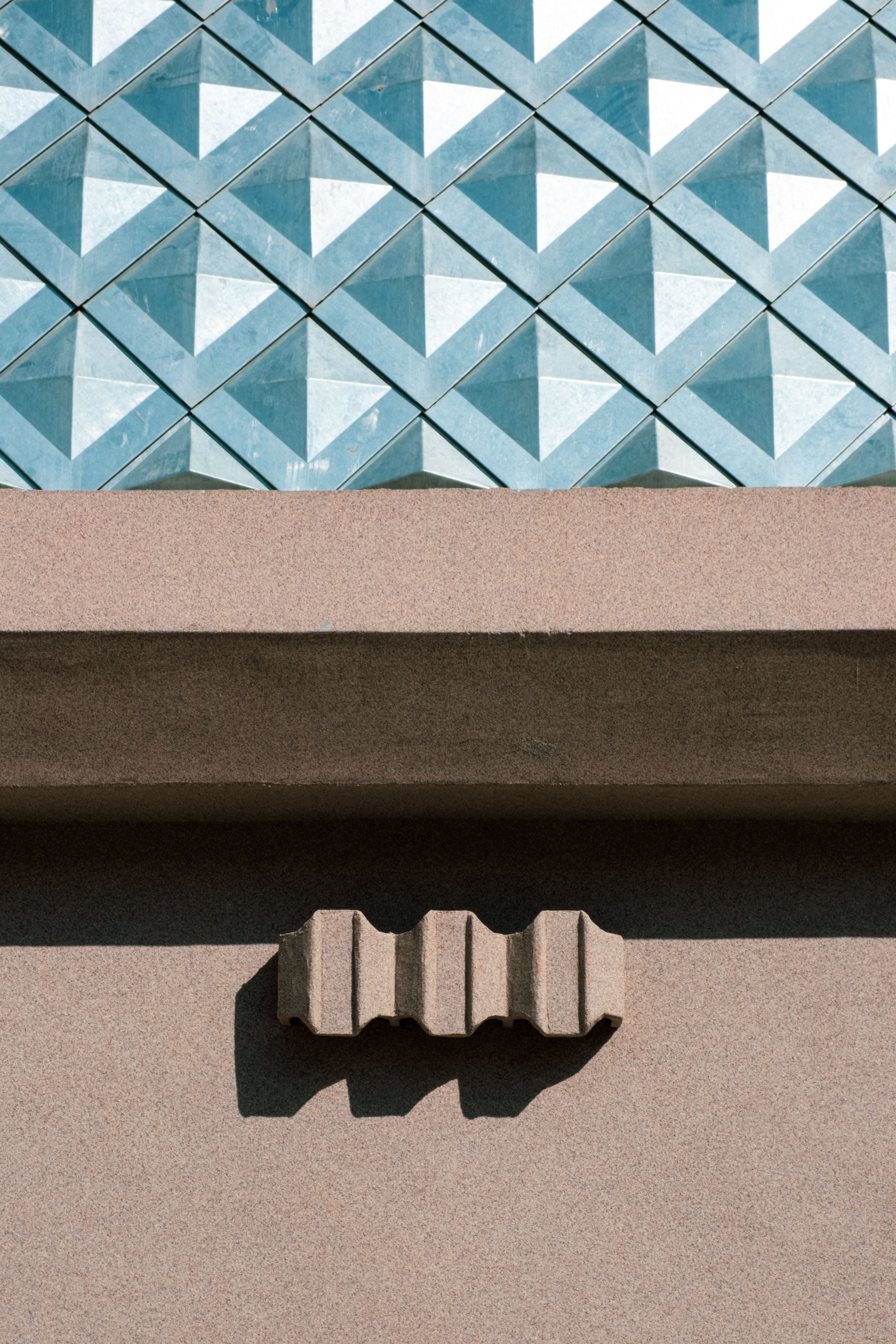 Contemporary architecture showcasing a unique geometric facade and textured design.