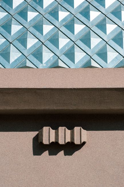 Contemporary architecture showcasing a unique geometric facade and textured design.