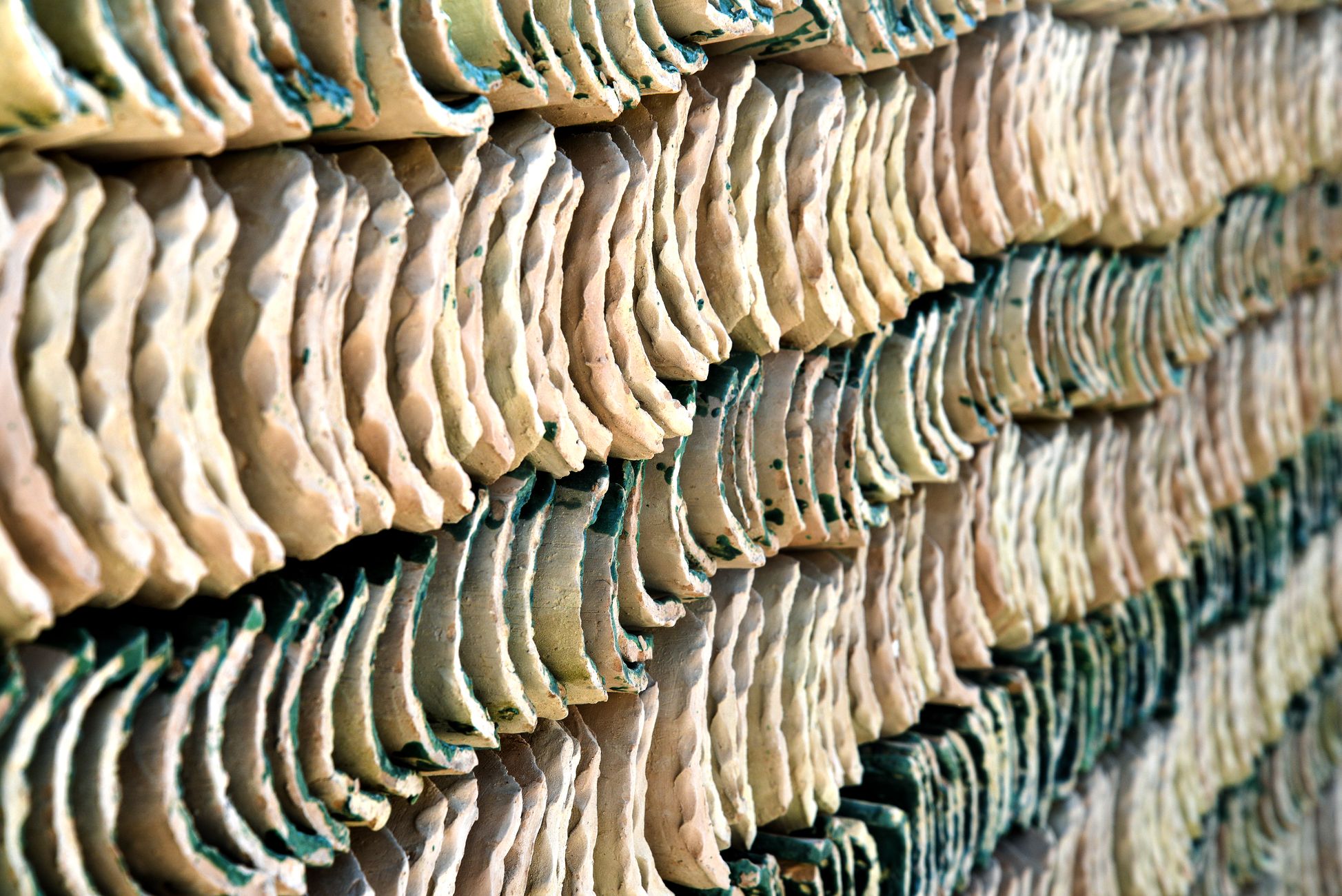 Close-up of handcrafted pottery drying in the sun in Fès, Morocco showcasing traditional craftsmanship.