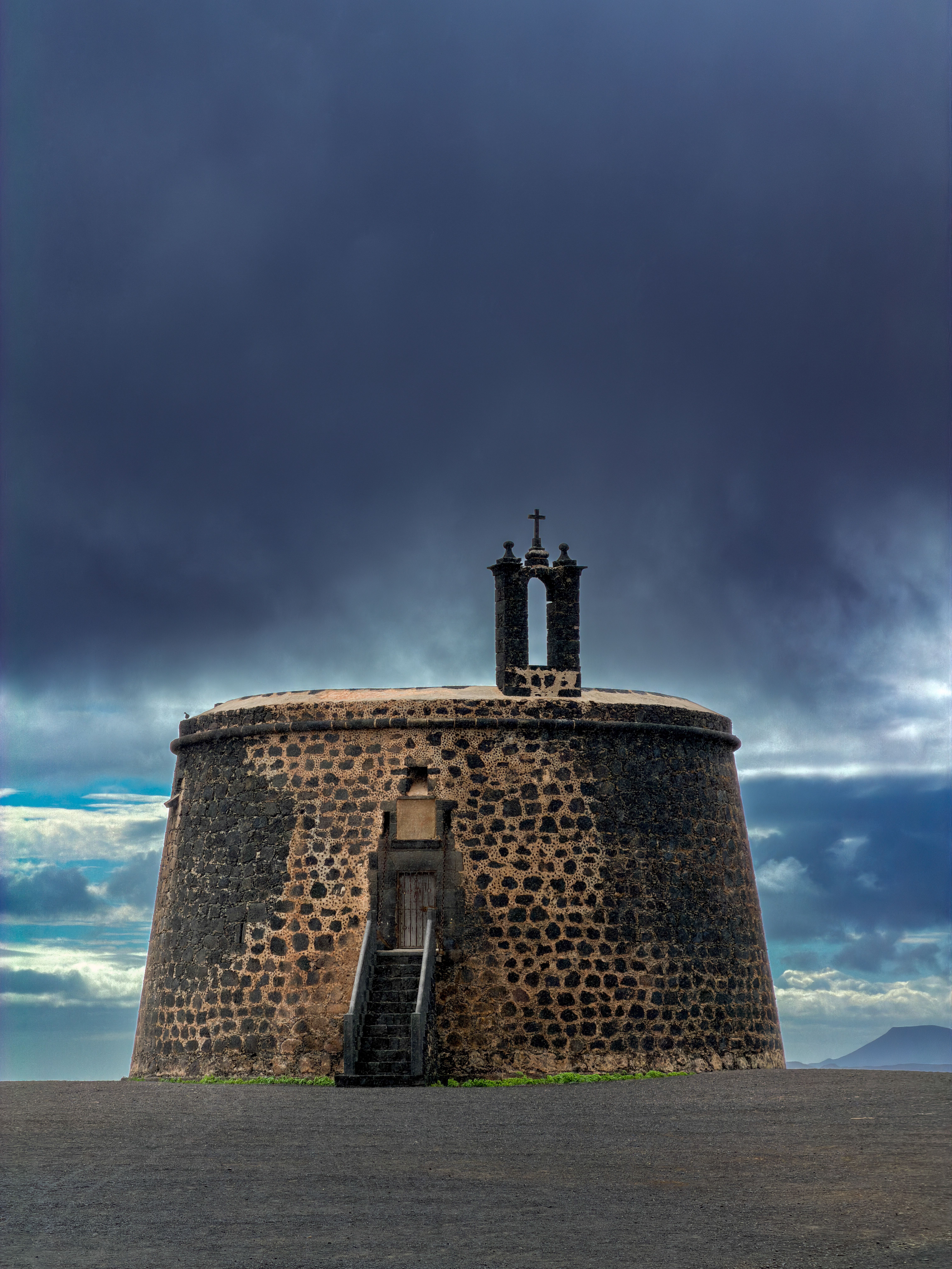 Historic Stone Tower Under Moody Sky · Free Stock Photo
