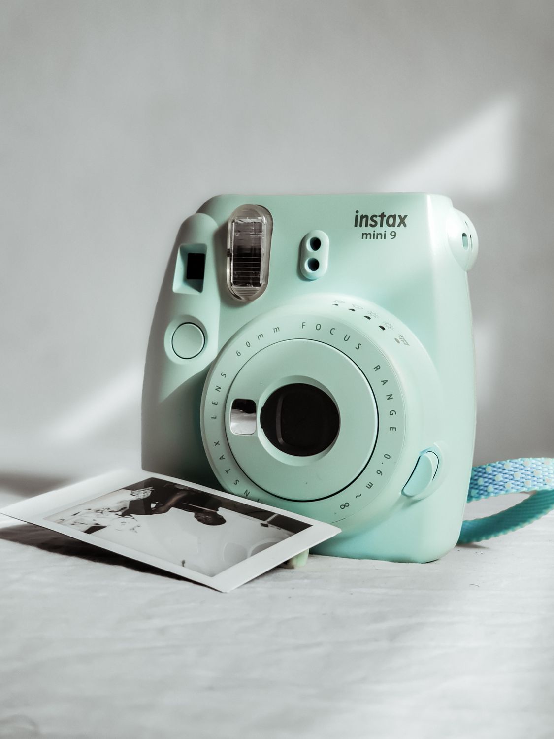 Teal and White Camera on White Table · Free Stock Photo