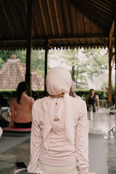 Participants engage in a peaceful outdoor yoga class in Jawa Barat, Indonesia.