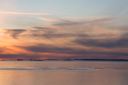 Free Captivating winter sunrise with ice on Stamford Harbor, Connecticut's serene coastline. Stock Photo