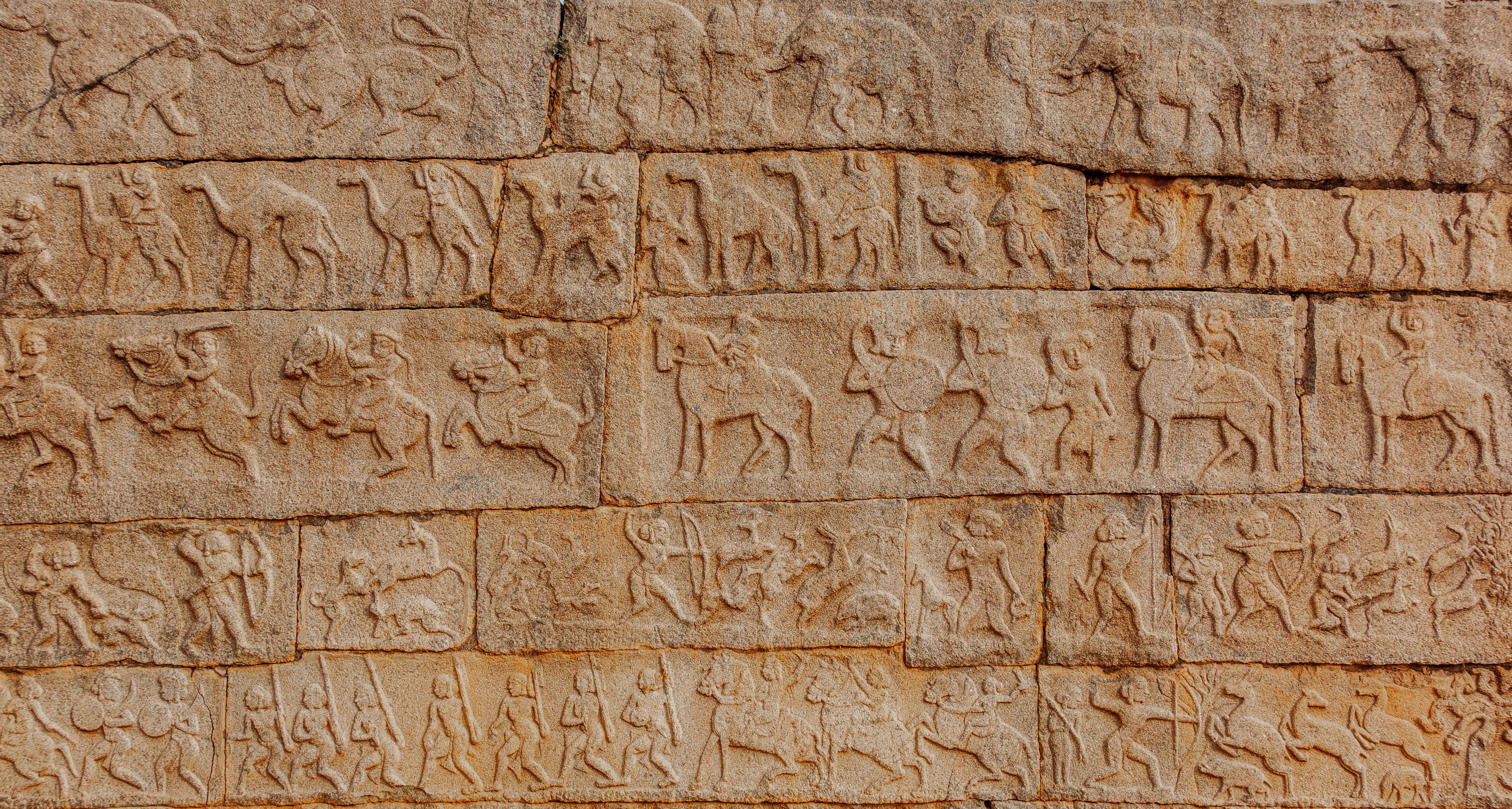 Ancient Stone Carvings of Historical Battle Scene · Free Stock Photo