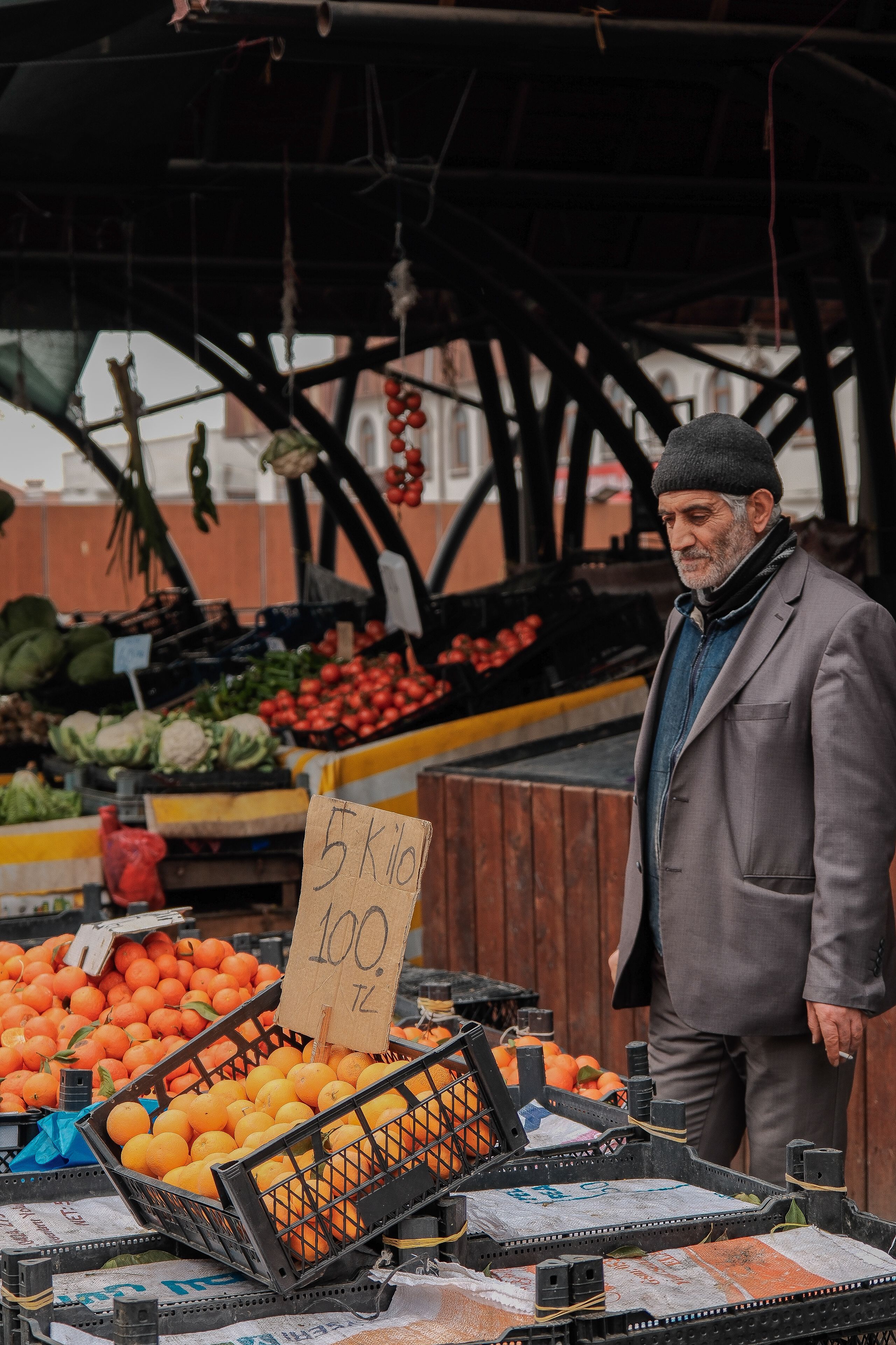 Man at Outdoor Market with Fresh Produce · Free Stock Photo