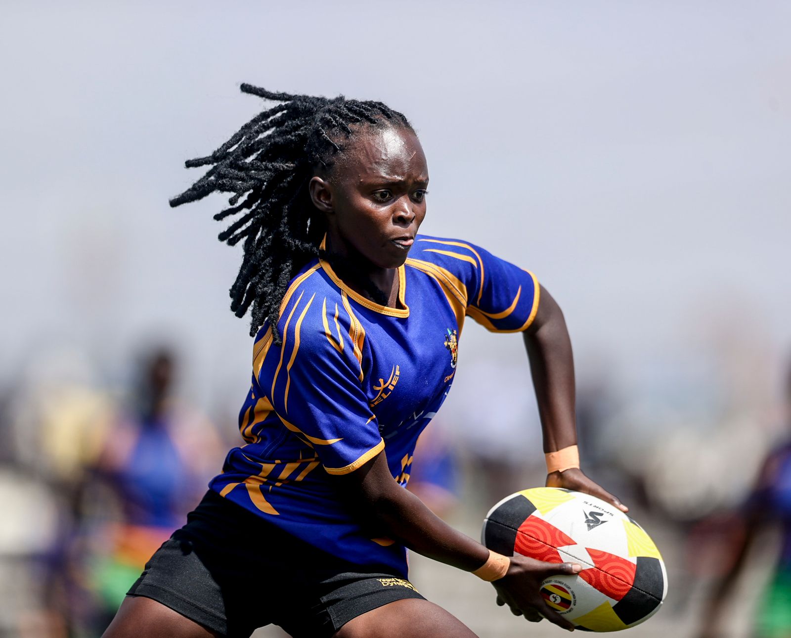Women's squad coach leading a training session