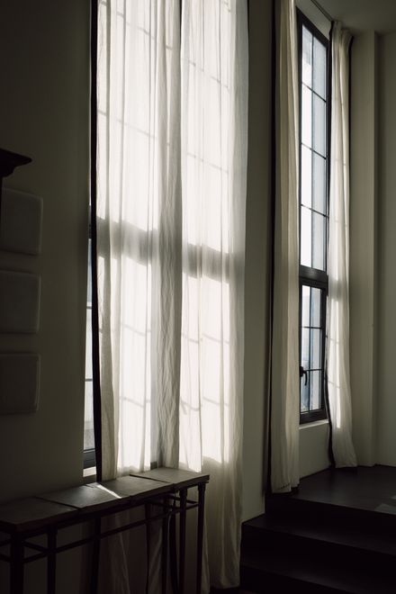 Sunlight filtering through tall sheer curtains — photo by Liuuu _61 on Pexels