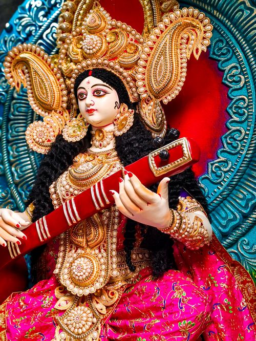 Free Intricately crafted idol of Goddess Saraswati with vivid ornaments, captured in Kolkata during a festival. Stock Photo