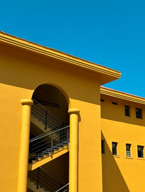 Free Striking minimalist architecture with bold colors and geometric shapes; perfect for modern design themes. Stock Photo
