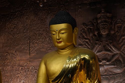 Free A golden Buddha statue with intricate carvings in a Seoul temple. Stock Photo
