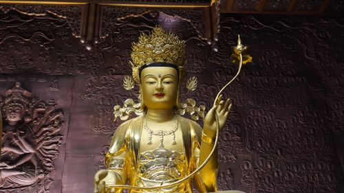 Free Golden Buddha statue with intricate carvings in a Seoul temple. Stock Photo