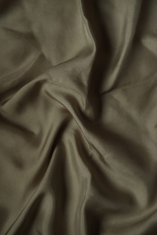 Free Close-up of elegant brown satin fabric showcasing smooth folds and texture. Stock Photo