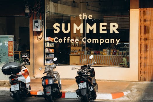 Three scooters parked outside a charming coffee shop in Bangkok.