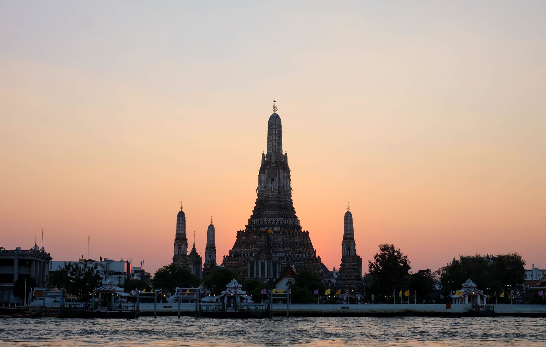 Wat Arun temple on the Chao Phraya river seen from Rattanakosin.