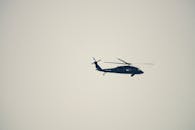 Helicopter in Flight Against a Clear Sky