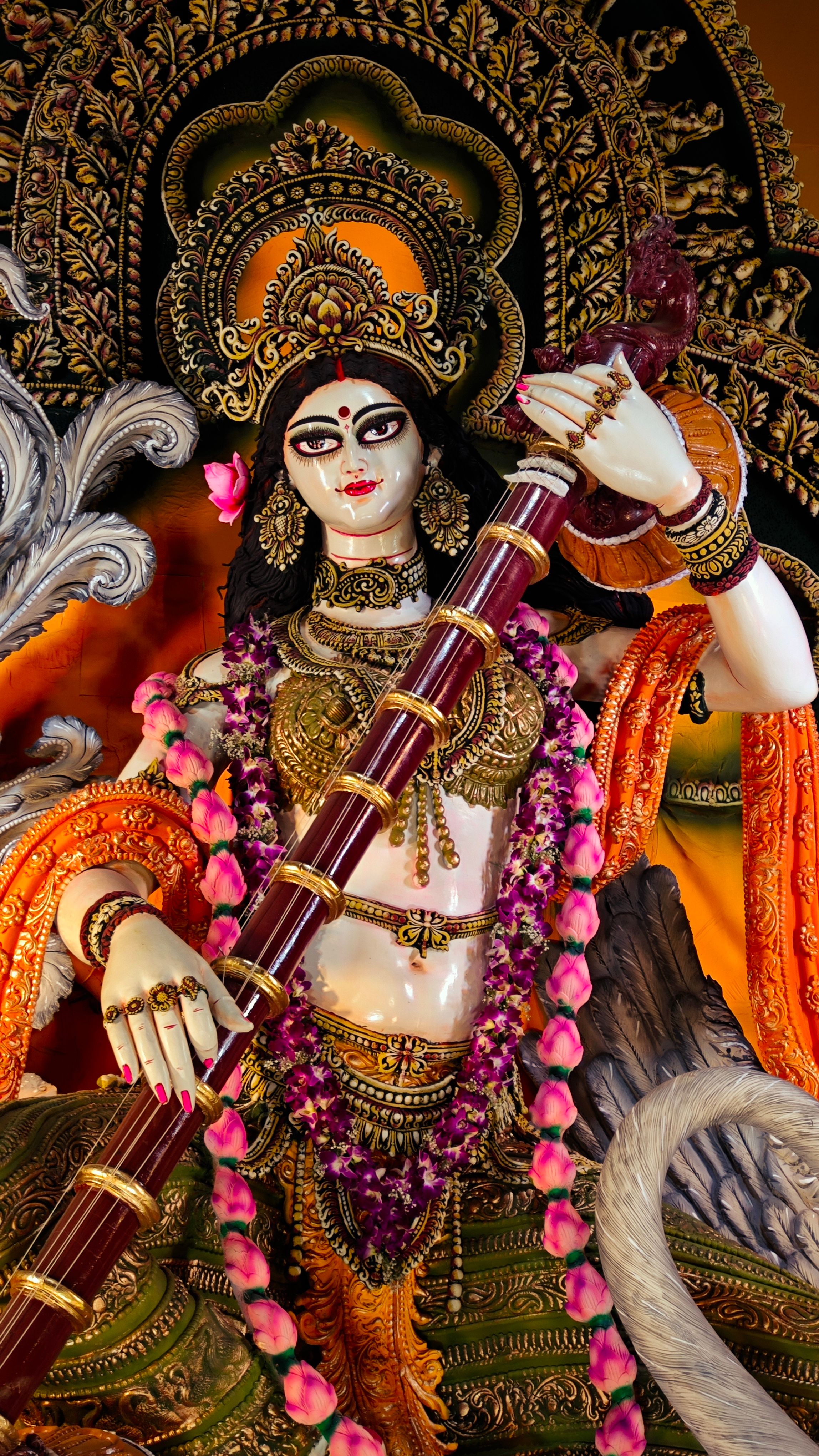 Detailed image of a goddess statue with ornate design and vivid colors, ideal for religious themes.