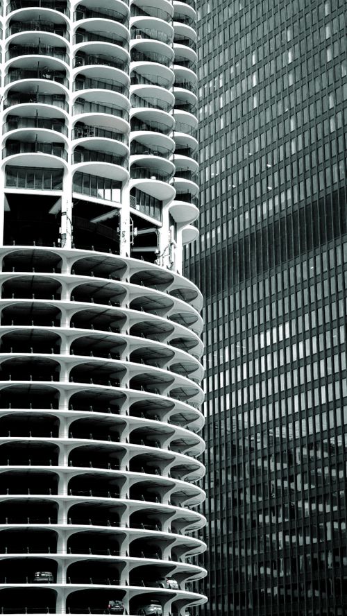 Free Architectural juxtaposition of Marina City Towers and a modern skyscraper. Stock Photo