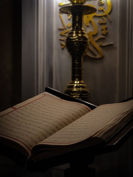Golden Religious Scripts Open Religious Book with Golden Script · Free Stock Photo