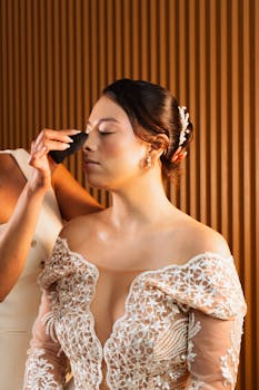 Bride receiving makeup touch-up before wedding ceremony in Mexico City.