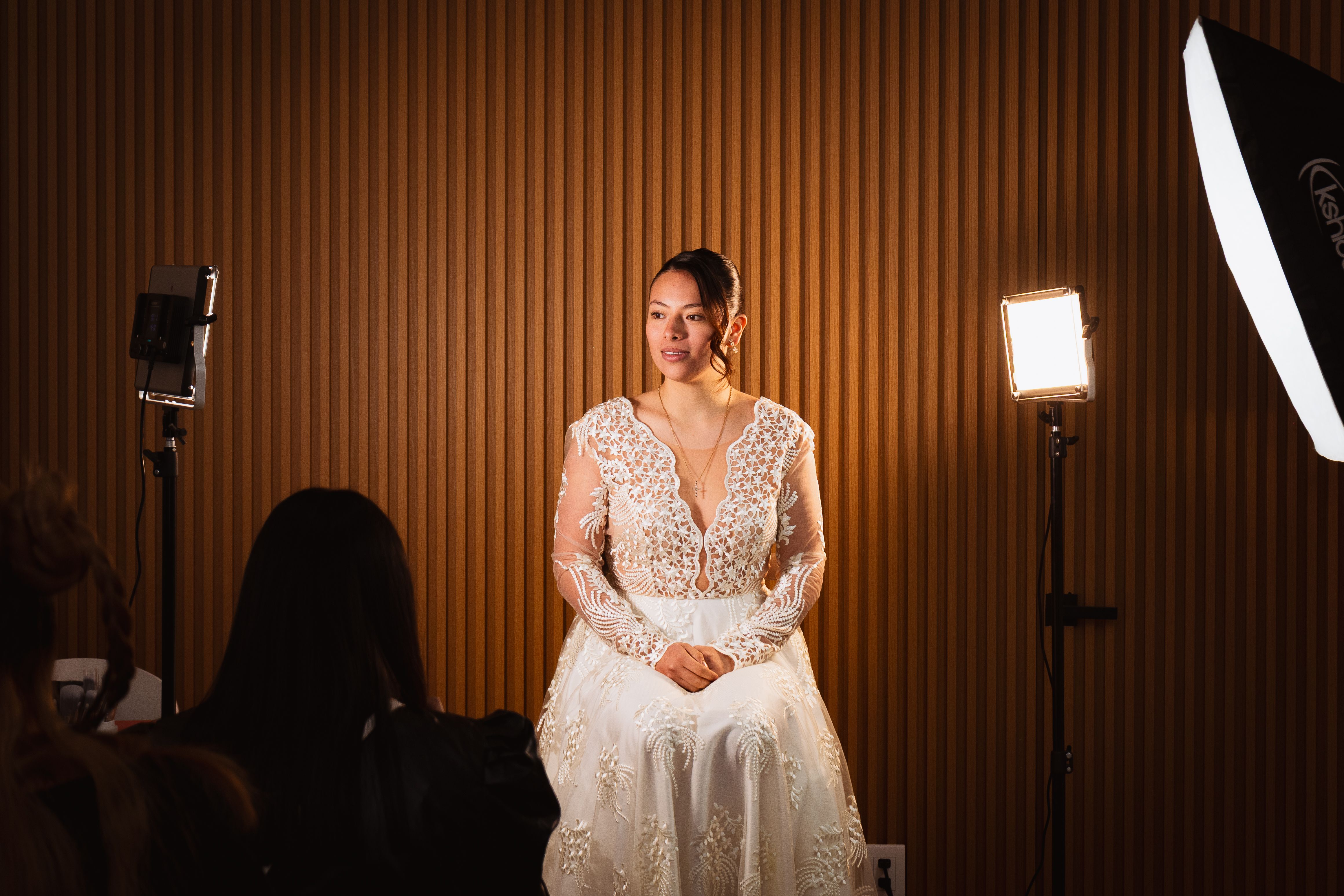 Bride elegantly poised indoors with studio lights in Mexico City, Mexico.