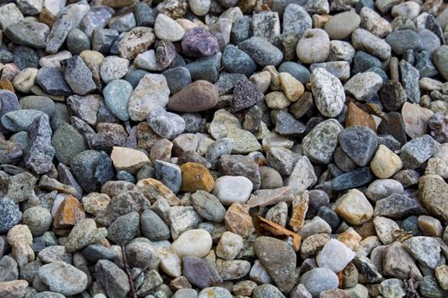 Free Colorful variety of smooth gravel pebbles creating a textured background. Stock Photo