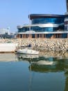 Sailboat Near Modern Waterfront Architecture