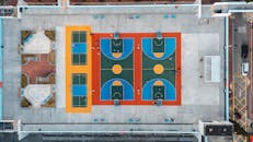 Aerial View of Colorful Rooftop Sports Courts in Kowloon