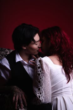 A loving couple shares a romantic kiss in an intimate and warm atmosphere.