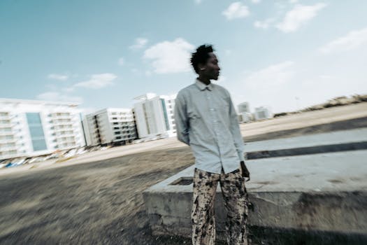 Blurred motion photo of a man in a cityscape setting creates motion and energy vibe.