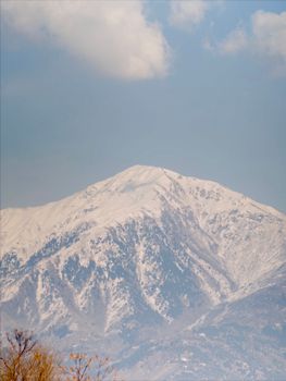 Captivating view of a snow-capped mountain under a clear sky, showcasing natural beauty.