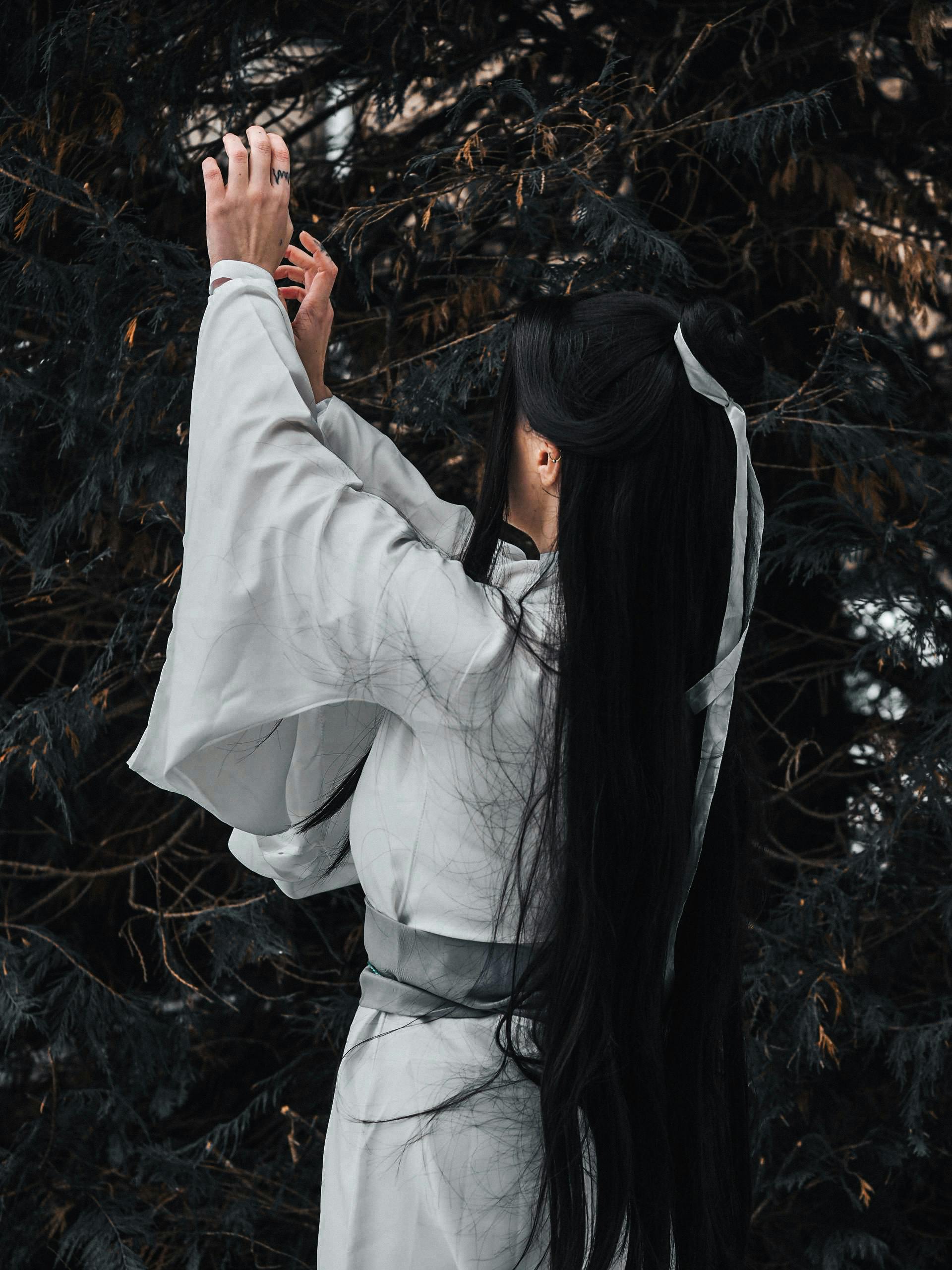 Elegant Woman in Traditional Clothing Amidst Nature