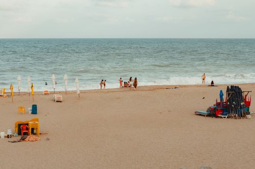 Free Scenic view of a crowded beach in Brazil with umbrellas and chairs ready for visitors. Stock Photo