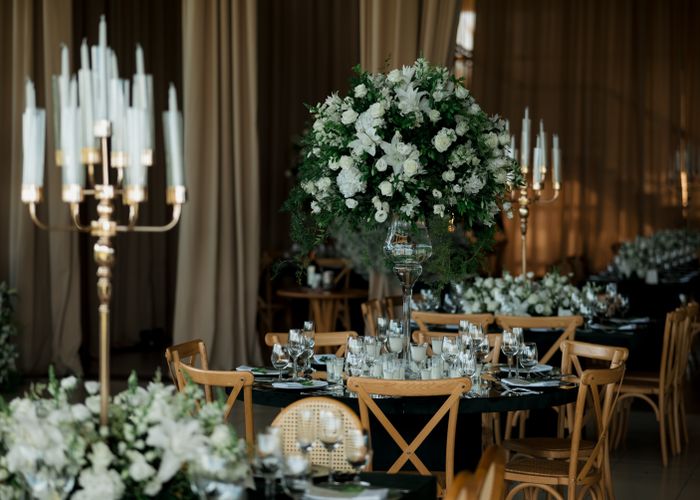 Candlelit wedding reception with floral arrangements